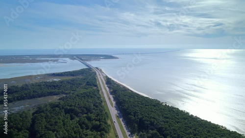 Aerial view on Fisherman island National Wildlife Refuge in Virginia. Traffic is driving on toll highway passing through Chesapeake bay 