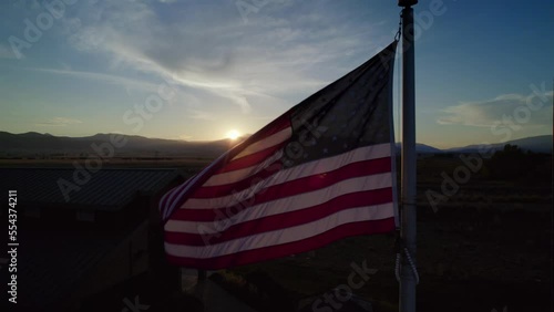 American flag is waving on sunset background
