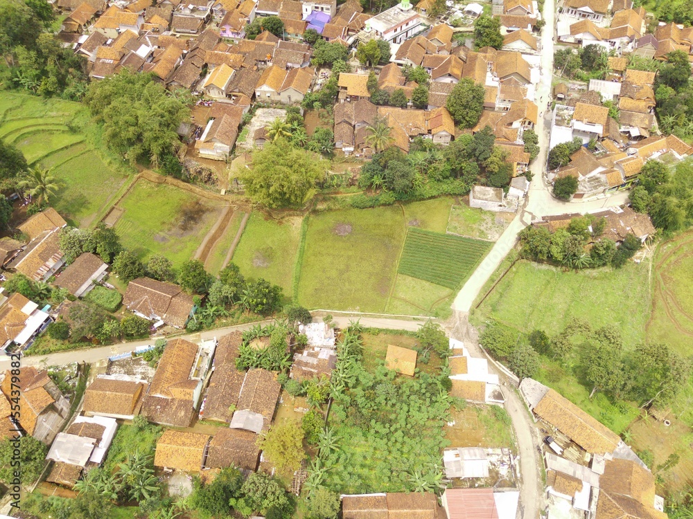 Fototapeta premium Abstract Defocused Blurred Background Aerial hill surrounded by residential areas in Cikancung - Indonesia. Not Focus