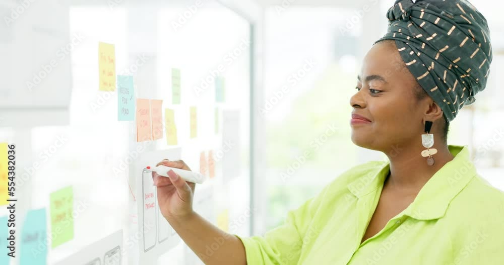 Planning, strategy and black woman writing on sticky note for marketing, schedule and vision of idea on a board. Goal, creative and business woman with a plan, work and brainstorming on a moodboard Planning, strategy and black woman writing on sticky note for marketing, schedule and vision of idea on a board. Goal, creative and business woman with a plan, work and brainstorming on a moodboard