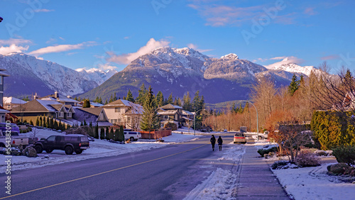 Winter walking in Garibaldi Highlands, Squamish, BC, with Garibaldi Mountain in background. photo