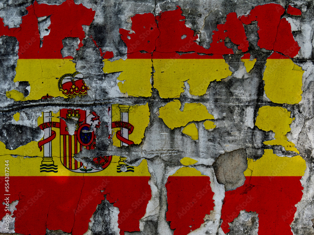 Spanish flag on cracked concrete wall