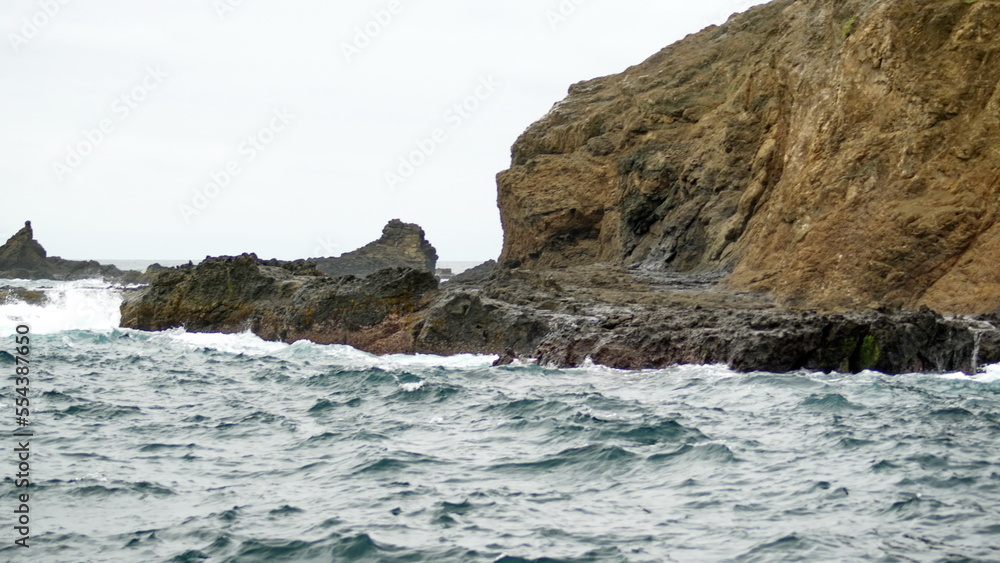Waves breaking on the rocky coast of Isla de la Plata, in the Machalilla National Park, off the coast of Puerto Lopez, Ecuador