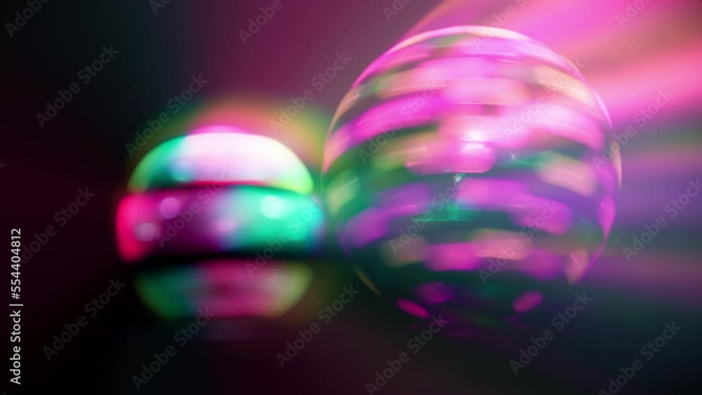 Spinning glowing pink disco balls Spinning glowing pink disco balls