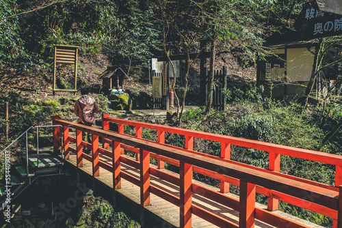 12 April 2012 a wooden red bridge in spring at Kifune Shrine photo