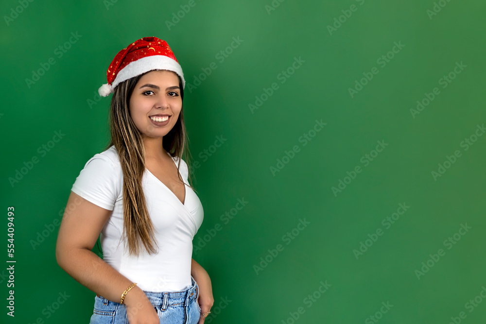 Woman in Santa hat for product demonstration Woman in Santa hat for product demonstration