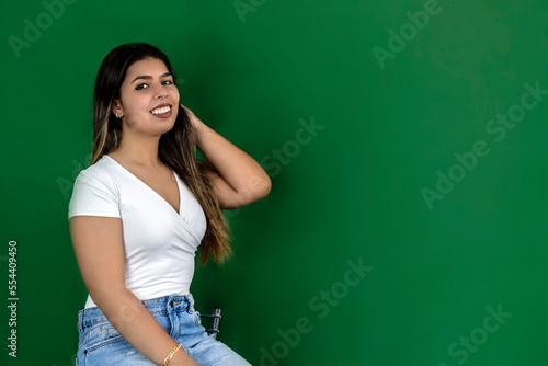Girl on green background in promotional pose © Nadiadspringer