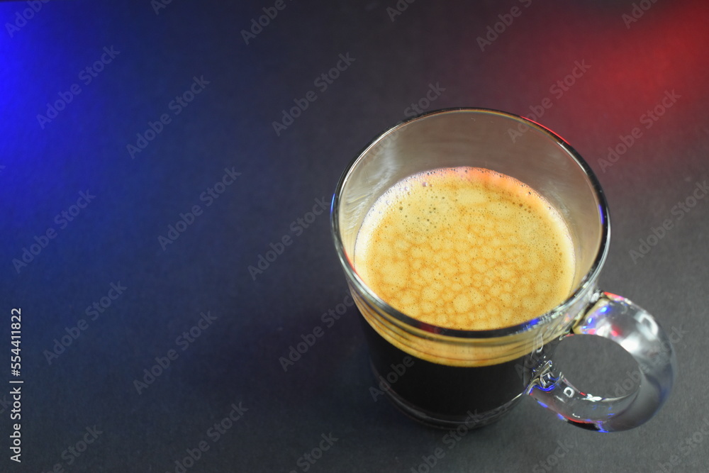 black coffe on black table with neon lights black coffe on black table with neon lights