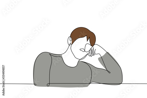 man sitting with his head down to the left leaning on his hand - one line drawing vector. concept fatigue, reflections, tiredness, drowsiness