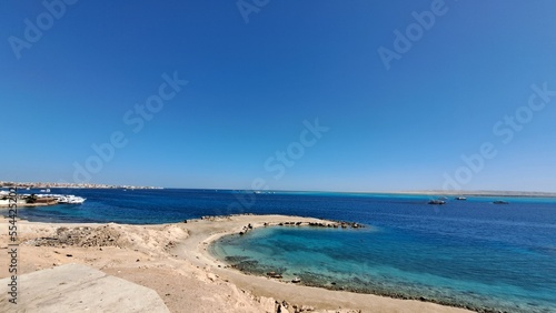 Beach and sea. Blue sky and white clouds. Boats. Red sea. Egypt. Hurghada