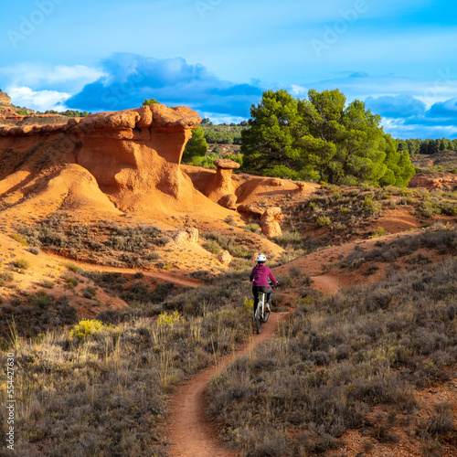 Active woman on a mountain bike in the nature