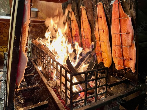 Flame grilled salmon, a traditional Nordic dish, at the Christmas market in Lindau, Germany.