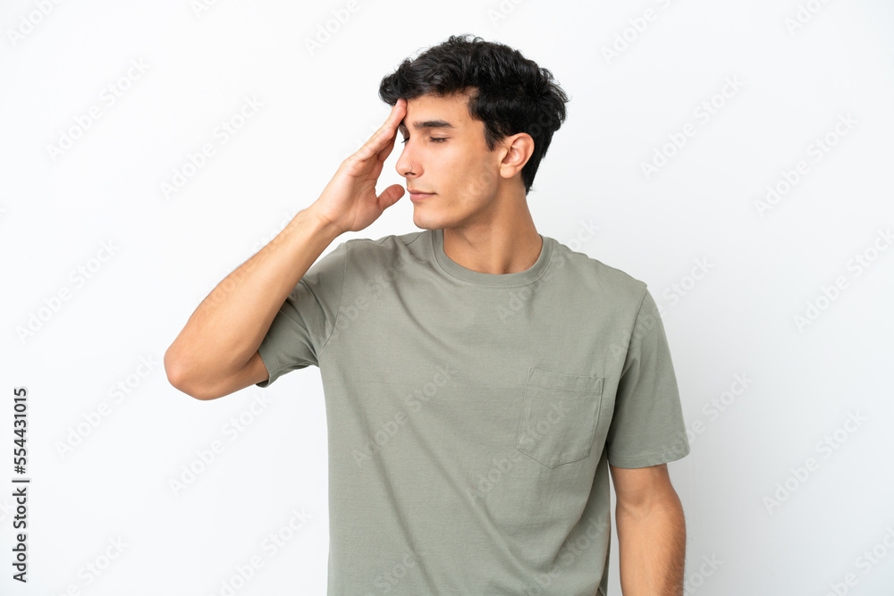 Young Argentinian man isolated on white background with headache Young Argentinian man isolated on white background with headache