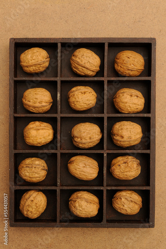 box with compartments filled with walnuts