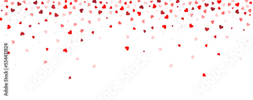 Background consisting of falling, flying small red hearts on a white background. Background for lovers, for Valentine's Day, wedding. Heart pattern, confetti.
