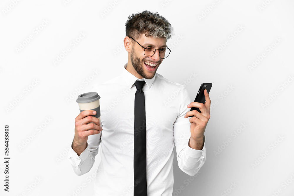 Business caucasian man isolated on white background holding coffee to take away and a mobile Business caucasian man isolated on white background holding coffee to take away and a mobile