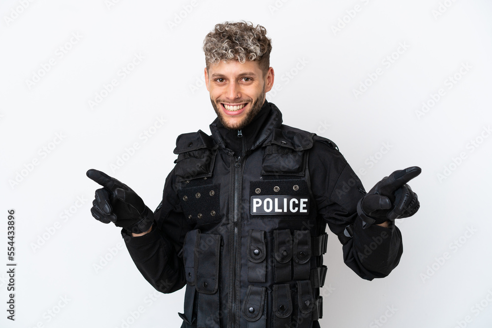 SWAT caucasian man isolated on white background pointing finger to the laterals and happy SWAT caucasian man isolated on white background pointing finger to the laterals and happy