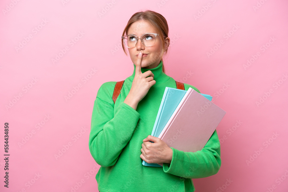 Young caucasian student woman isolated on pink background having doubts while looking up Young caucasian student woman isolated on pink background having doubts while looking up
