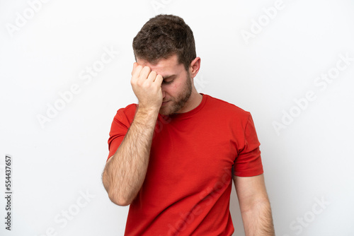 Young caucasian man isolated on white background with headache