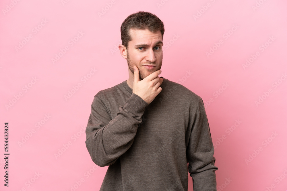 Young caucasian man isolated on pink background thinking Young caucasian man isolated on pink background thinking