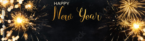 HAPPY NEW YEAR 2024 Celebration holiday Sylvester, New Year's Eve Party, Fireworks, Firework background banner panorama long- Burning sparkling sparklers on dark night sky..