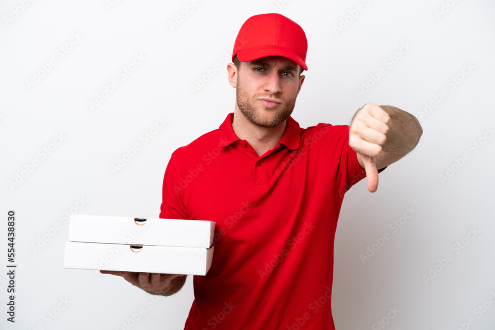 Pizza delivery caucasian man with work uniform picking up pizza boxes isolated on white background showing thumb down with negative expression Pizza delivery caucasian man with work uniform picking up pizza boxes isolated on white background showing thumb down with negative expression