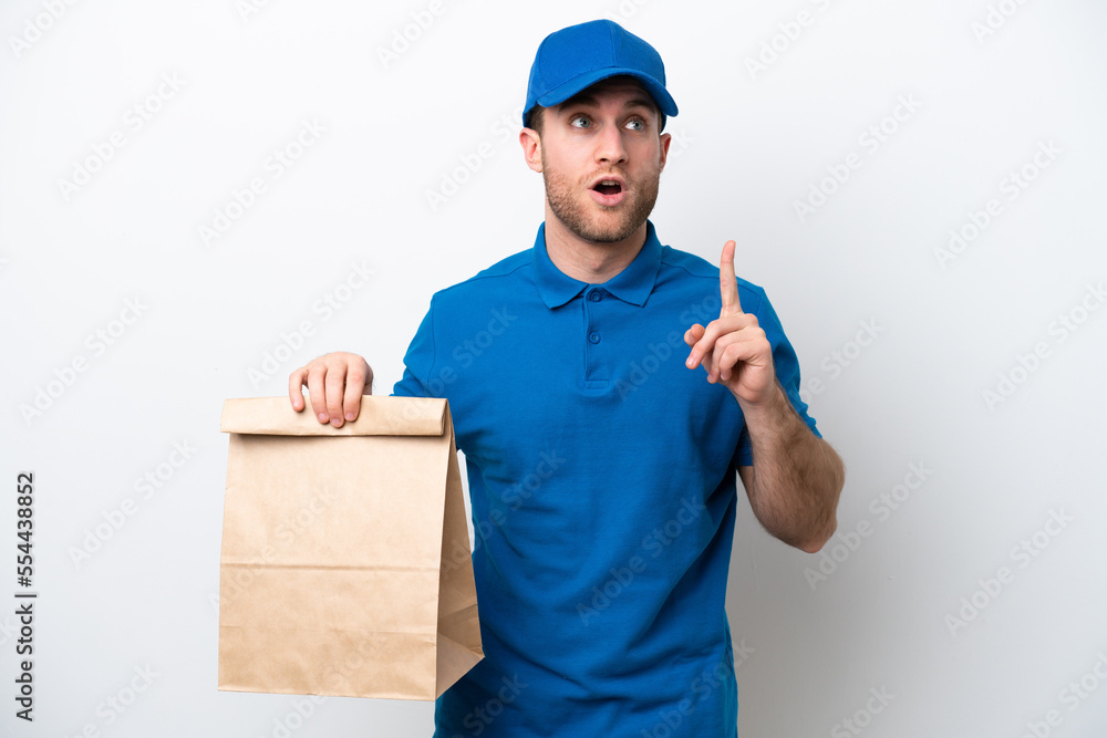 Delivery caucasian man isolated on white background thinking an idea pointing the finger up Delivery caucasian man isolated on white background thinking an idea pointing the finger up