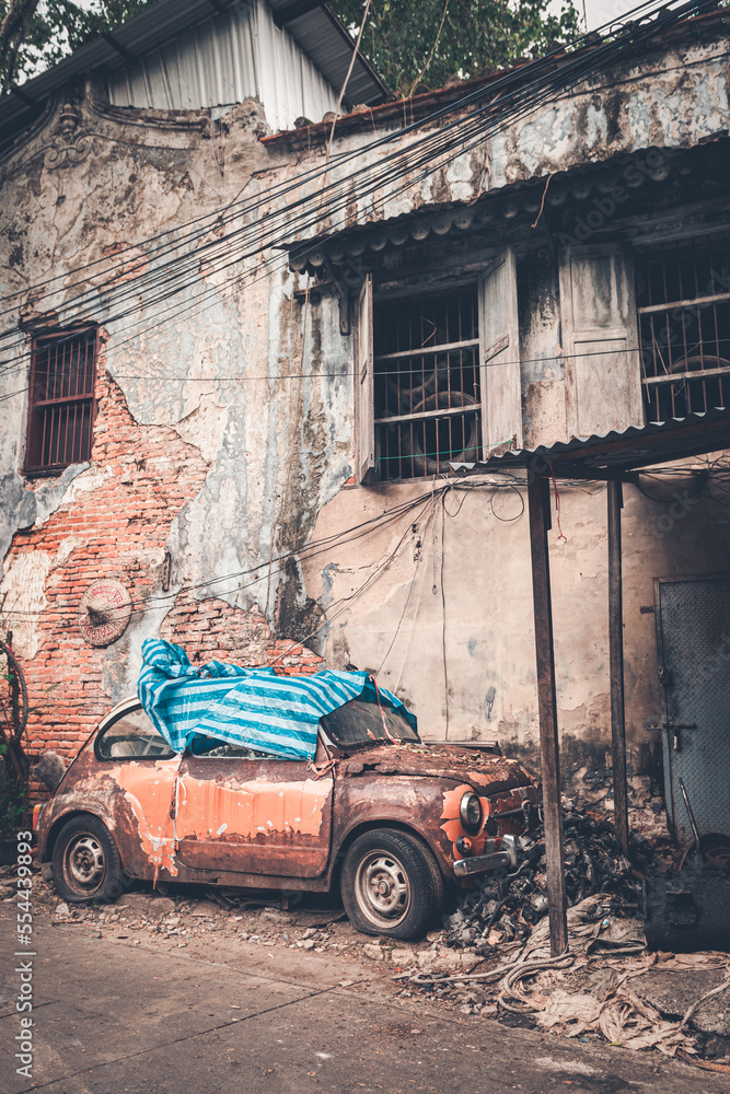 Broken car park in old slum village in Bangkok