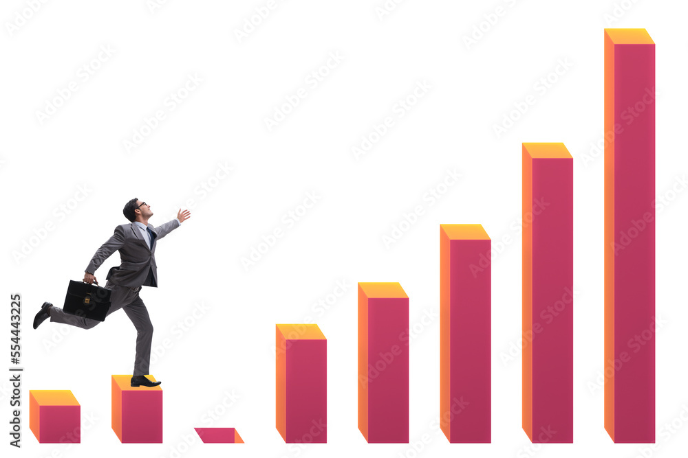 Businessman in growth concept with bar charts Businessman in growth concept with bar charts