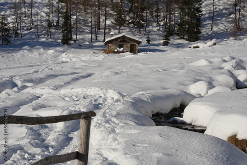 Winter Alps: snow covered cottage near the forest © travel nature