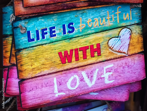 Wooden sign life is beautiful with love