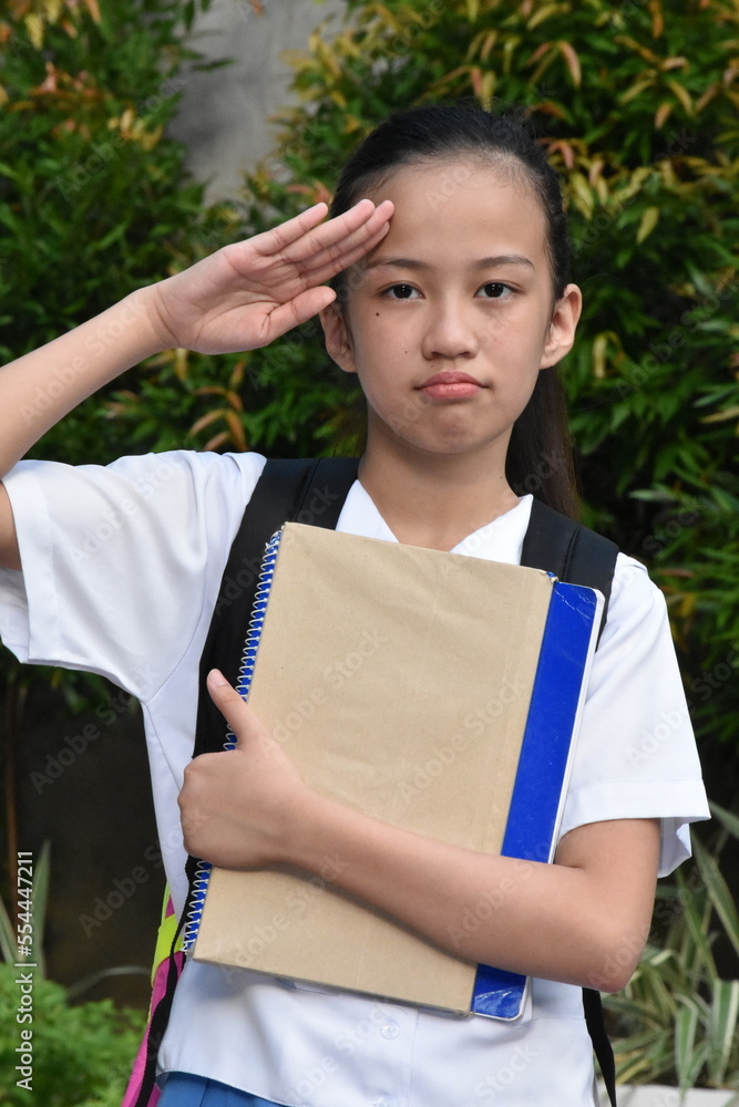 Saluting Cute Asian Female Student With Books Saluting Cute Asian Female Student With Books