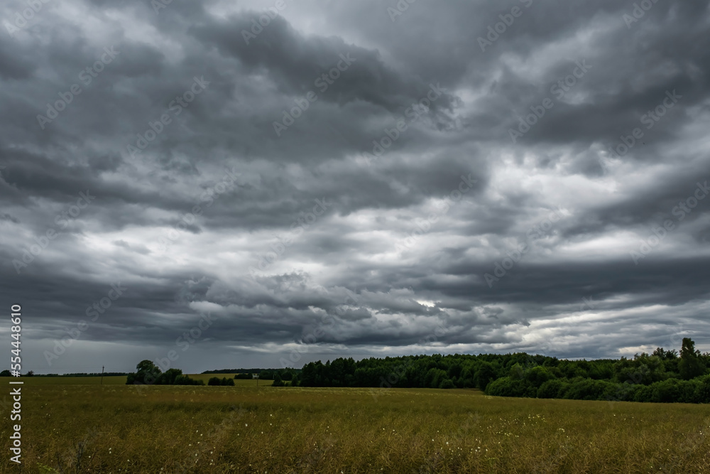 panorama of black sky background with storm clouds. thunder front panorama of black sky background with storm clouds. thunder front
