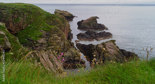 rocky coastline, about one kilometer east of Cruden Bay photo