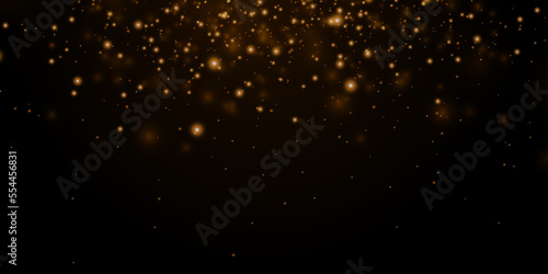 Gold sparks and golden stars glitter special light effect. Vector sparkles on transparent background. Christmas abstract.