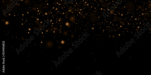Gold sparks and golden stars glitter special light effect. Vector sparkles on transparent background. Christmas abstract.