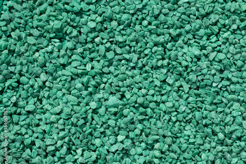 heap of green rock pieces of natural small mineral rock stones gemstone particles. Decorative Stone pebbles for coating in the garden. close up top view, filled frame