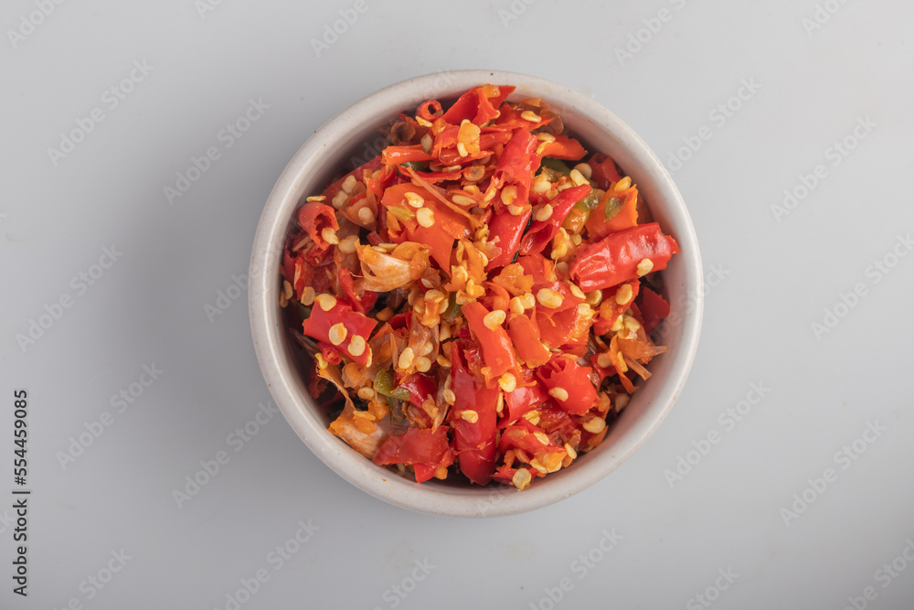 Freshly ground red chilies in a white cup Freshly ground red chilies in a white cup