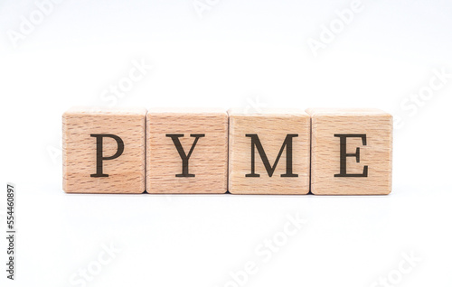 word " pyme " written in wooden blocks on white background 