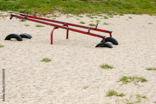 Canvas-taulu Bayfield, Canada - A rusty see-saw resting on tires on an empty sandy beach