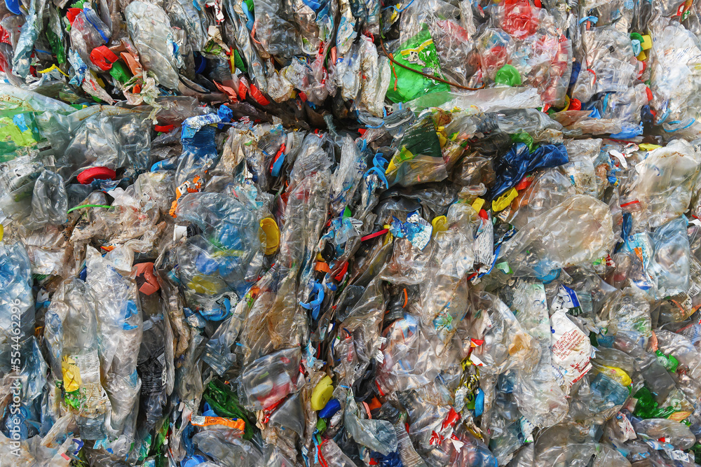 Close-up of a pile of compressed plastic waste collected for recycling
