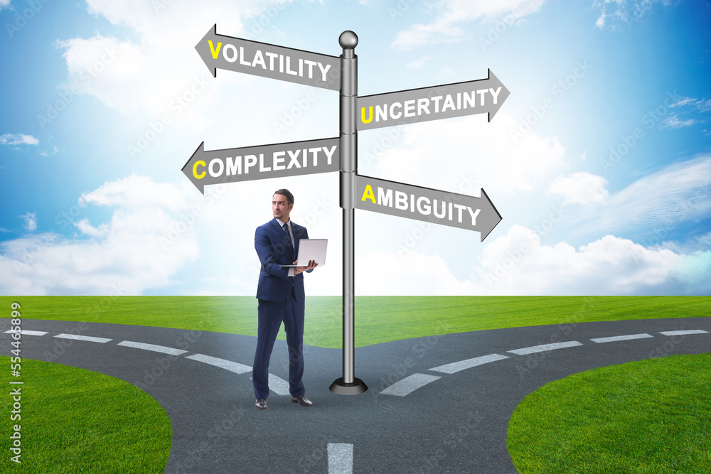 Businessman at the crossroads at VUCA concept Businessman at the crossroads at VUCA concept
