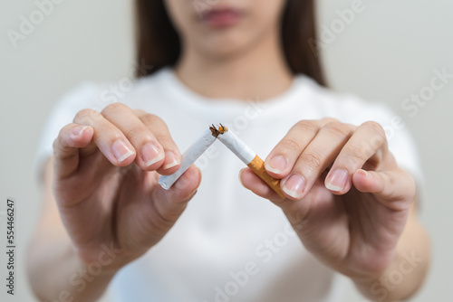 Close up hands of person refusing to smoke cigarette.