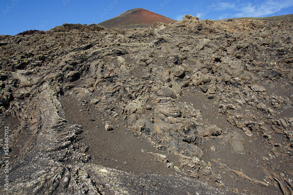 Volcanic landscapes of Lanzarote. Solidified lava, lava chimney, lava tunnel, sea of lava, eruption, canary islands, crater, volcano, black rocks, photographed in November 2022, trekking trip,Volcanic