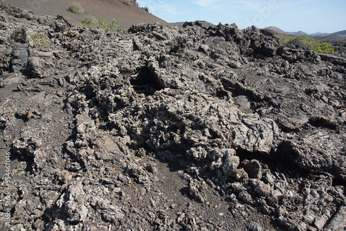 Volcanic landscapes of Lanzarote. Solidified lava, lava chimney, lava tunnel, sea of lava, eruption, canary islands, crater, volcano, black rocks, photographed in November 2022, trekking trip,