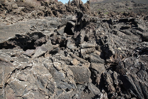 Volcanic landscapes of Lanzarote. Solidified lava, lava chimney, lava tunnel, sea of lava, eruption, canary islands, crater, volcano, black rocks, photographed in November 2022, trekking trip,