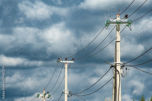 Power electric pole with line wire on colored background close up, photography consisting of power electric pole with line wire under sky, line wire in power electric pole for residential buildings photo