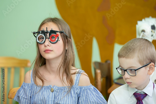 A girl in special glasses for the treatment of vision problems.