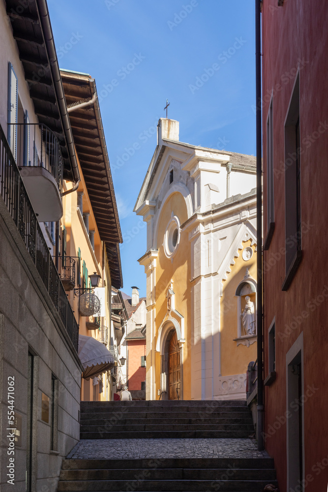 Low angle view of Saints Peter and Paul church in old Ascona, Switzerland (Tessin Canton). Copy space. Vertical.