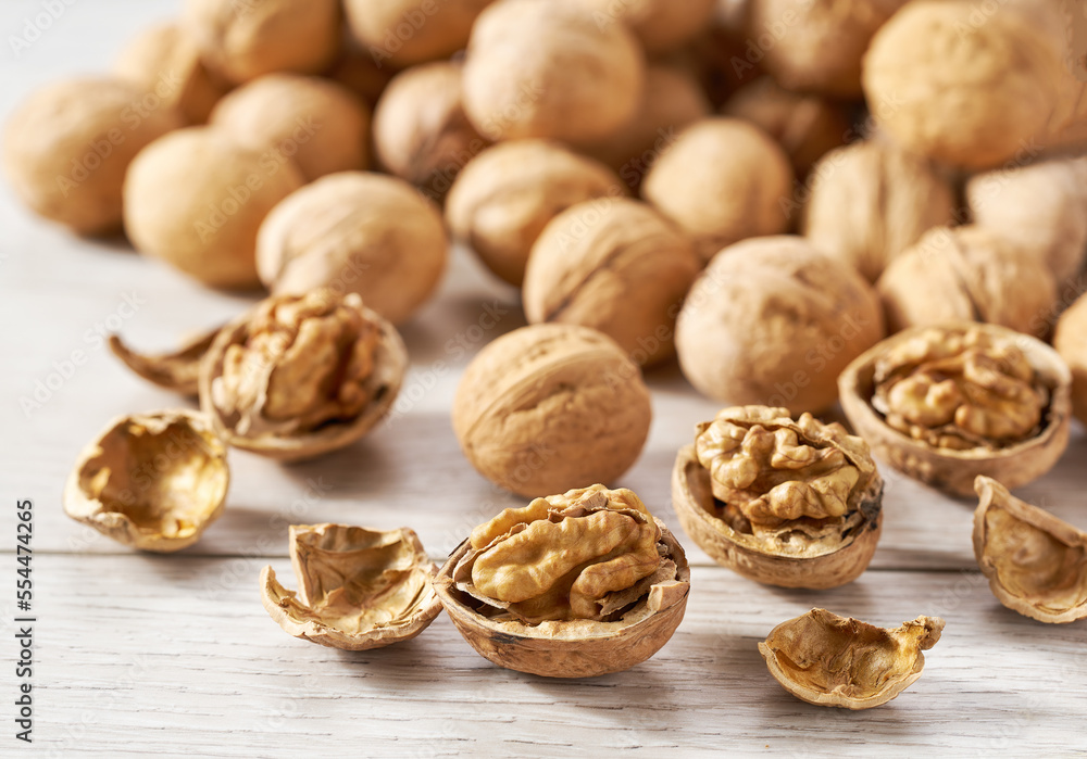 walnuts on a white kitchen table, selective focus. walnuts on a white kitchen table, selective focus.